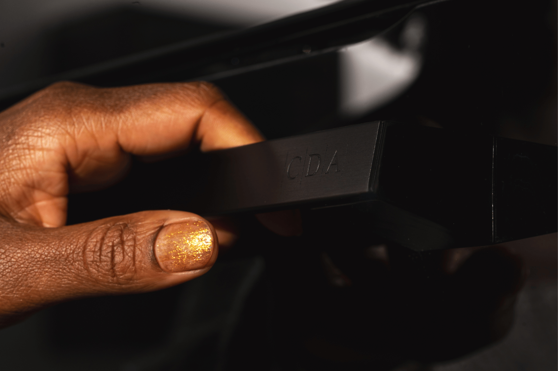 Hand on CDA oven handle