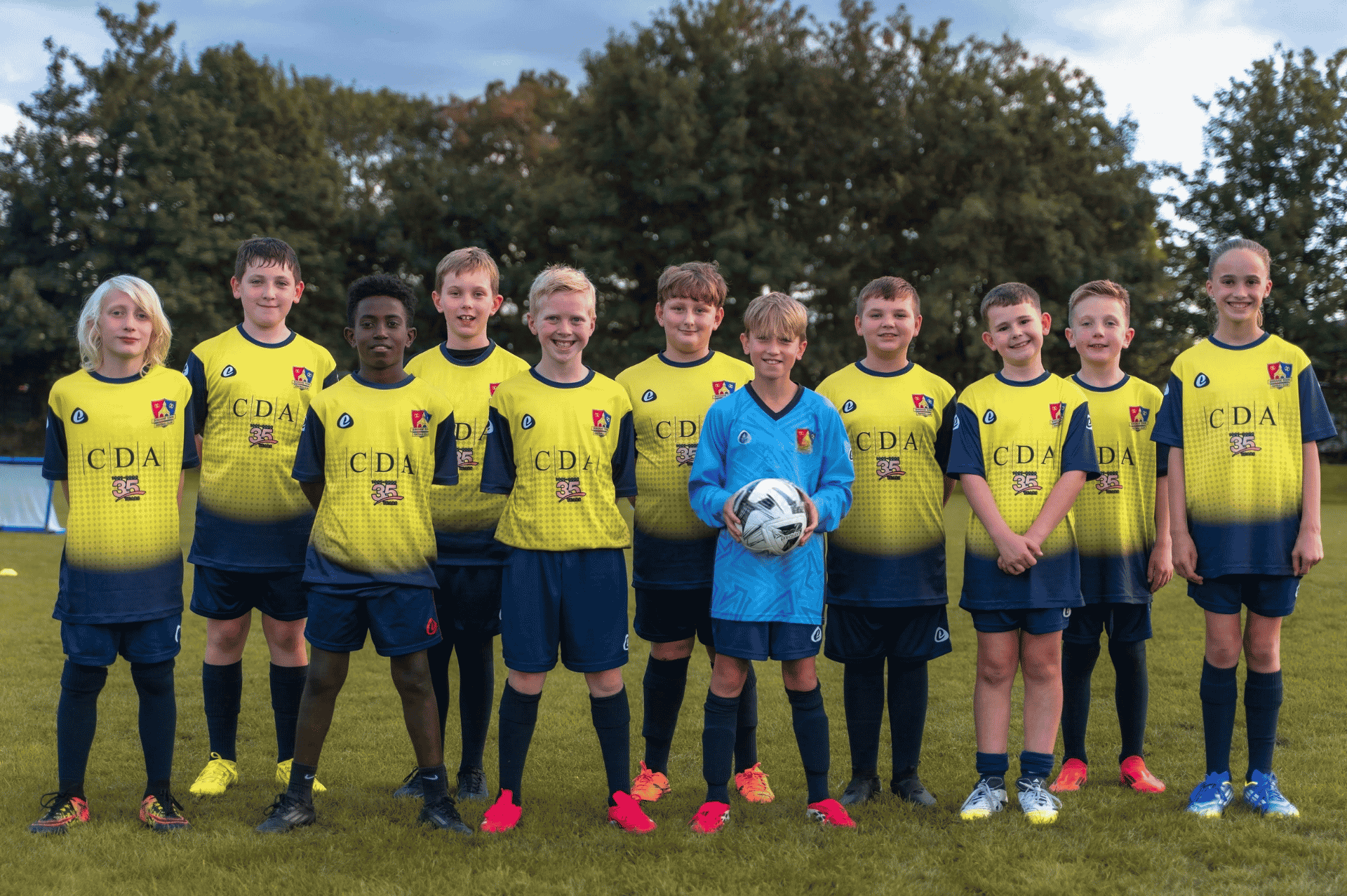 Bingham Town U11s Red football team wearing their CDA-sponsored kits ahead of the new season